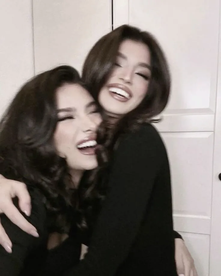 Two friends doing skincare together or lying in bed sharing secrets