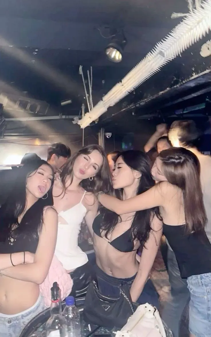 A feminine group walking into a party, soft glam lighting